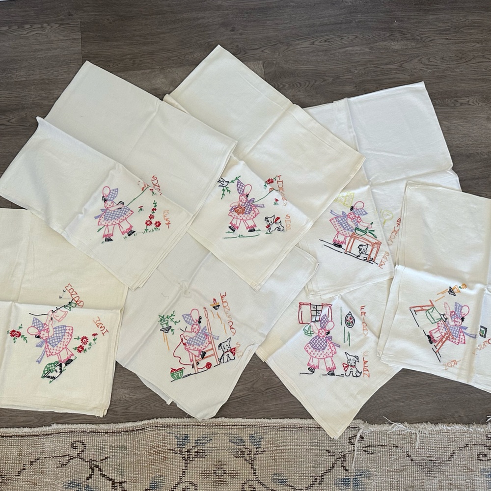 Vintage tea towels. Weekly chores hand stitched